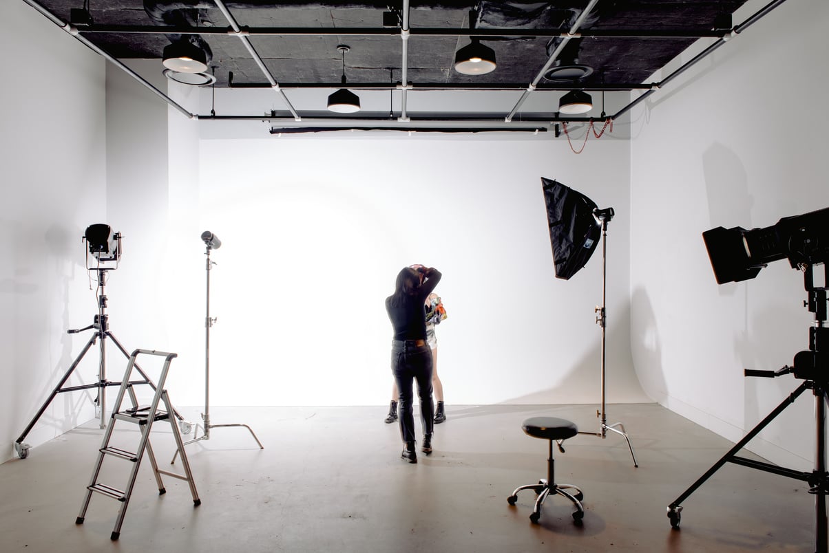 Professional photographer during photo shoot in studio