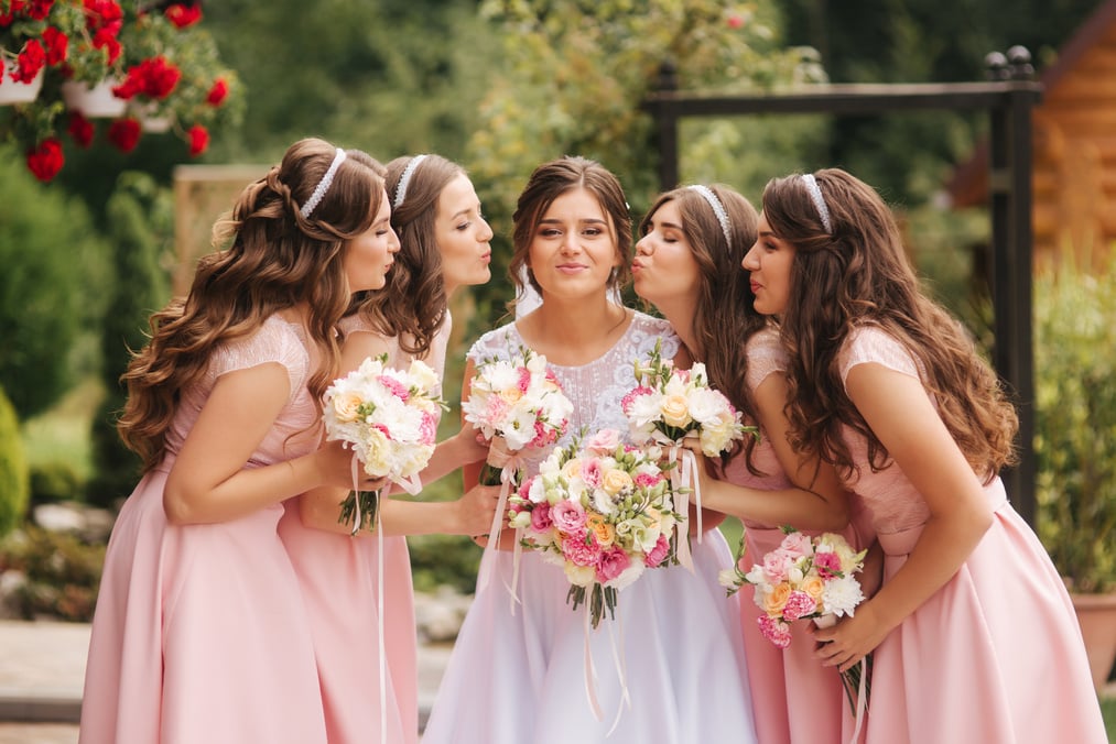 Happy Bride with Bridesmaids Outdoors