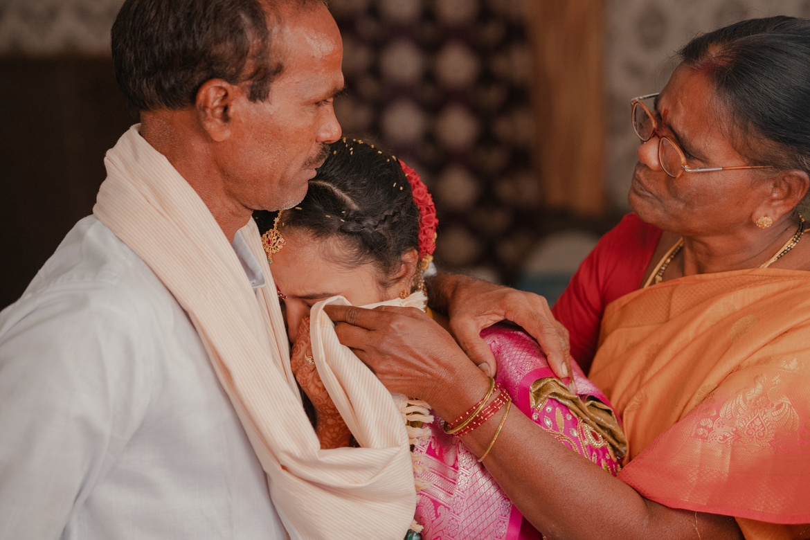 Indian Wedding Photo with a Crying Bride with Parents