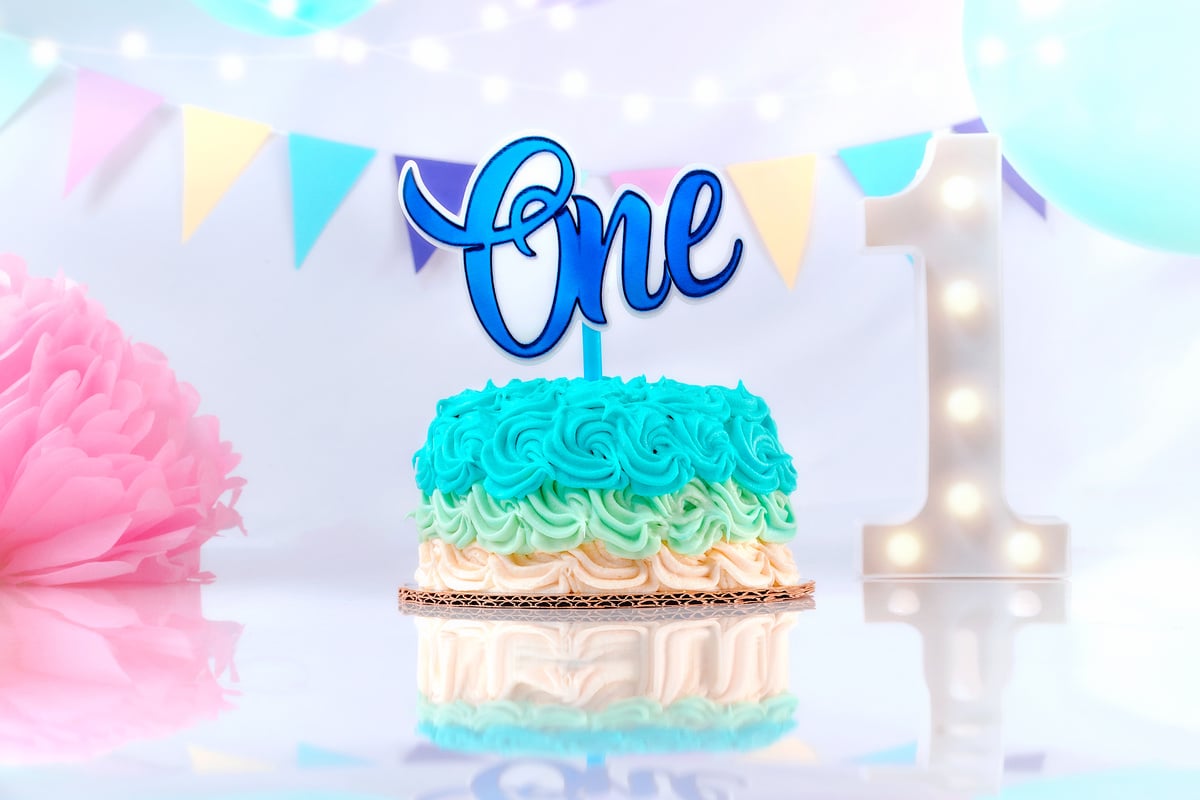 Blue First Birthday Cake with Decorations